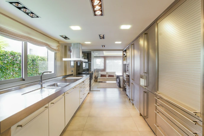 white wooden kitchen cabinet near window
